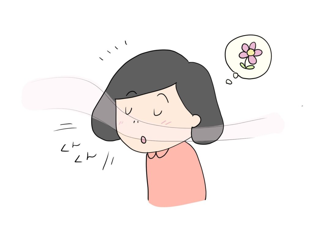 良い香りを嗅いでる人